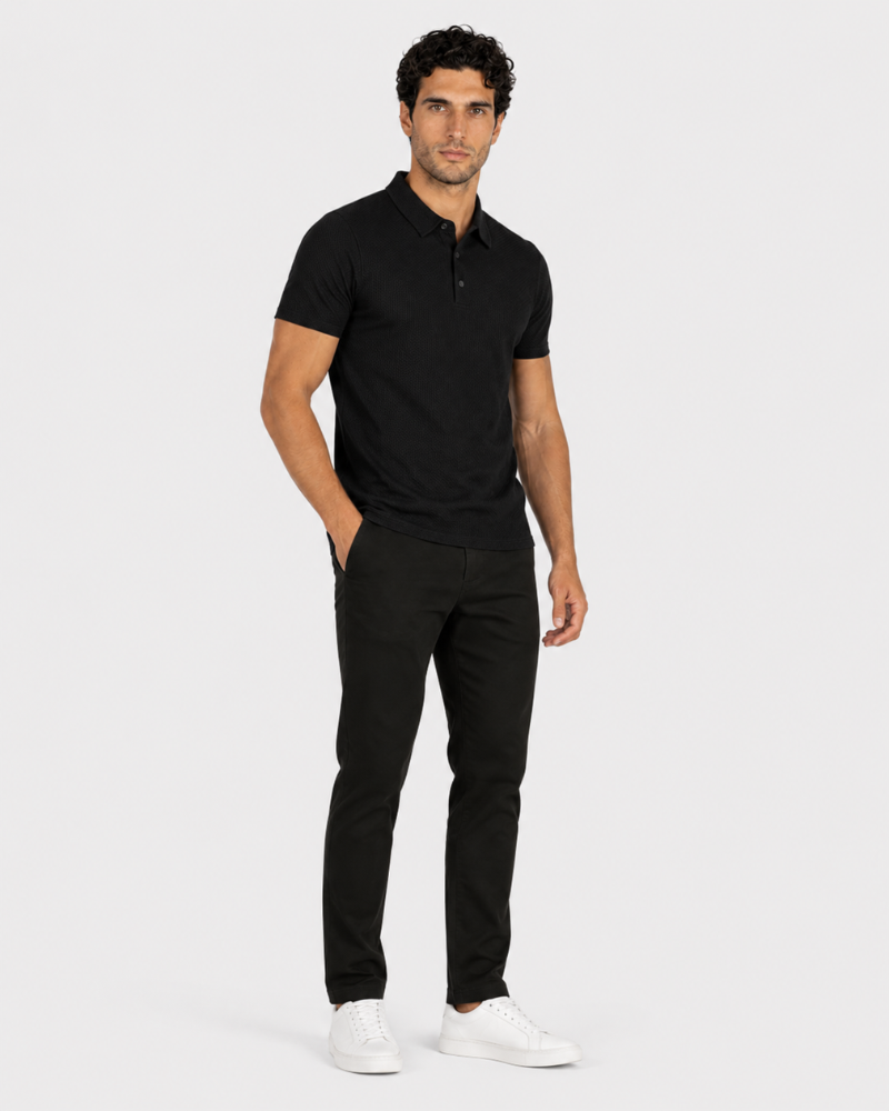 Man wearing a black polo shirt and pants on a white background #Color_black