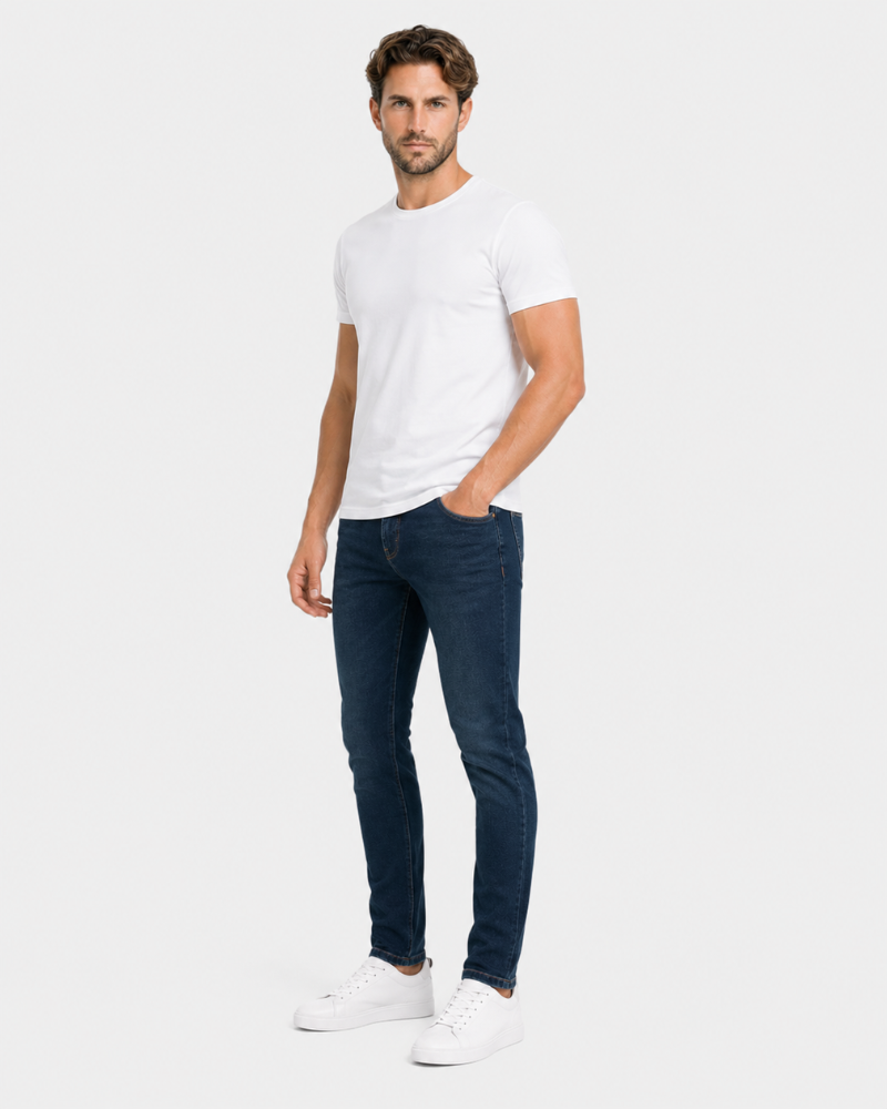 Man wearing a white t-shirt and dark jeans on a white background #Color_navy