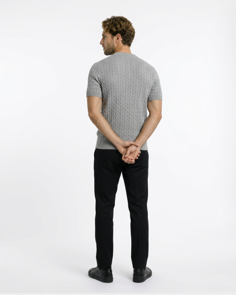 Back view of a grey cotton-blend cable knit t-shirt. Luxury minimalist short-sleeve sweater with premium texture.