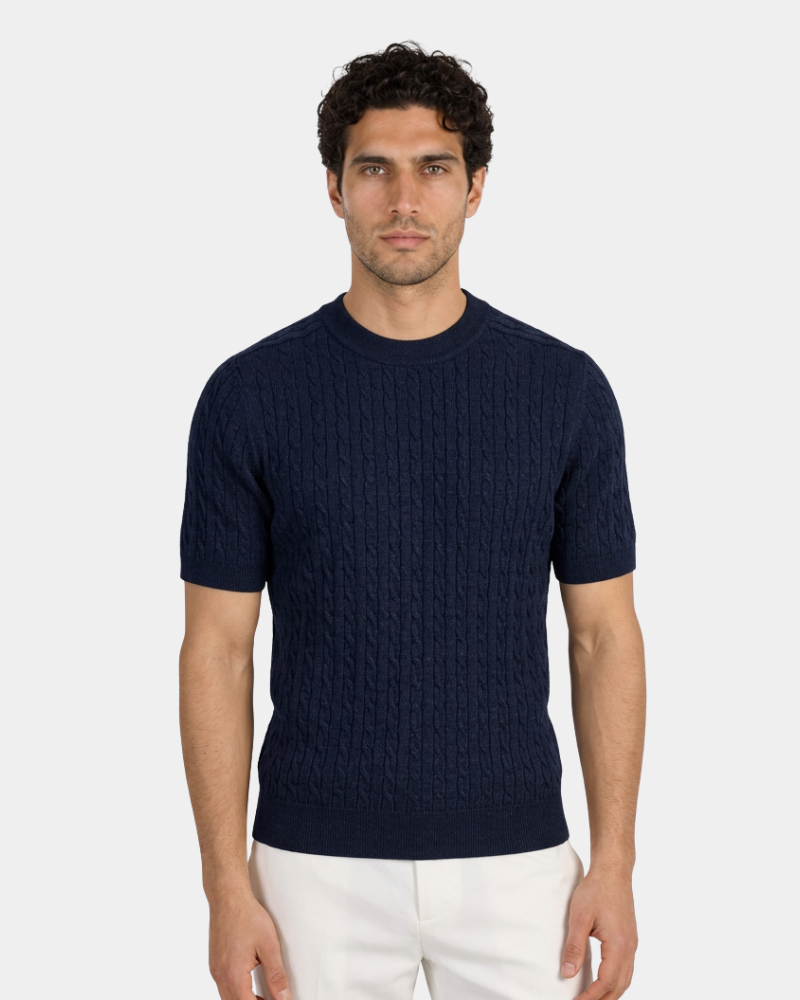 A navy wool-blend cable knit t-shirt. Luxury minimalist short-sleeve sweater with a soft texture and tailored fit.