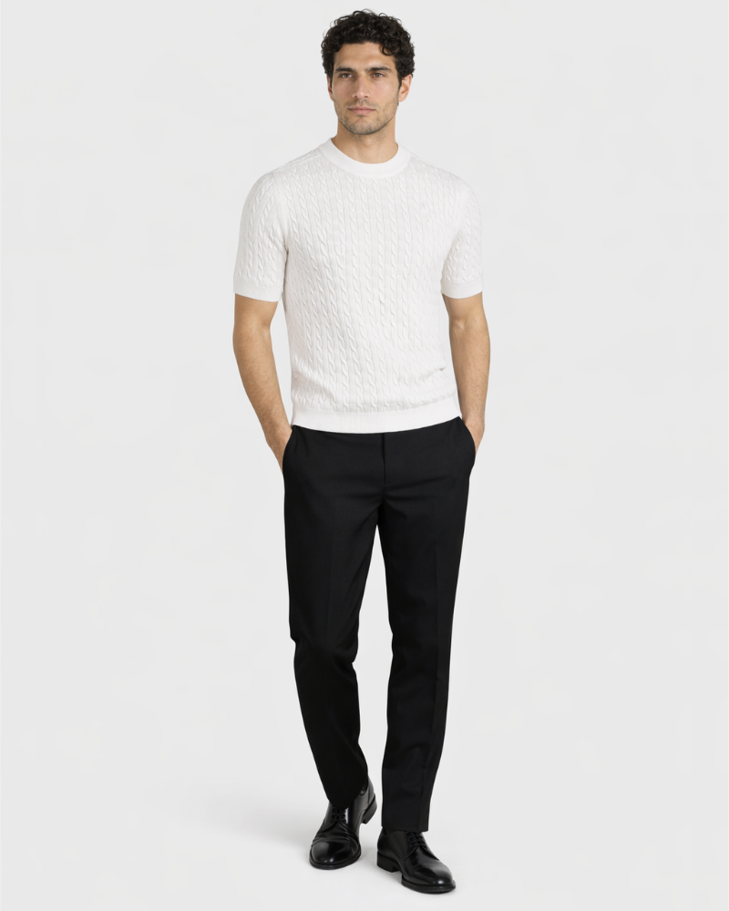 Minimalist luxury white cable knit t-shirt in premium cotton. Slim fit paired with black trousers for a timeless look.