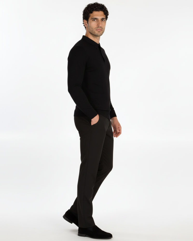 Side view of By Alden luxury black merino wool knit polo. Minimalist slim fit with a refined drape and seamless collar profile. #color_black