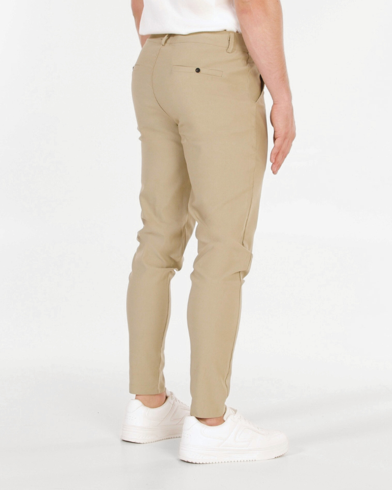By Alden Minimalist luxury beige stretch cotton chinos in a slim fit, featuring a smooth matte texture and welt back pockets. #color_beige