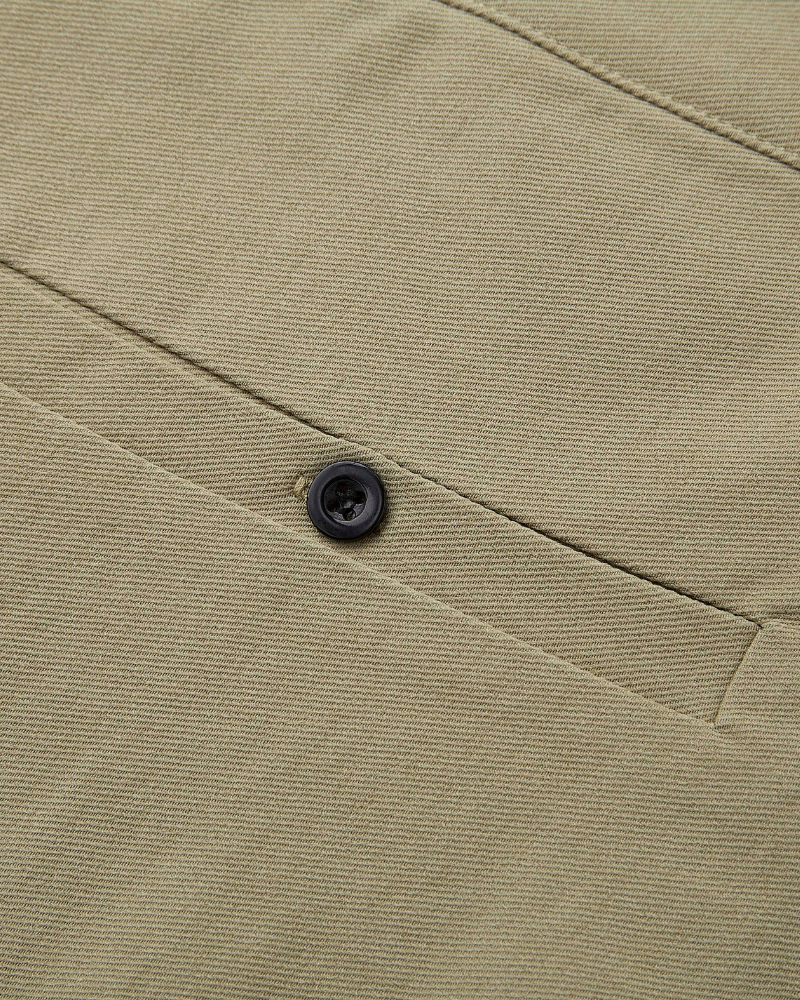 By Alden Minimalist luxury olive chinos in a breathable cotton-twill weave, featuring a premium matte black button and welt pocket. #color_beige