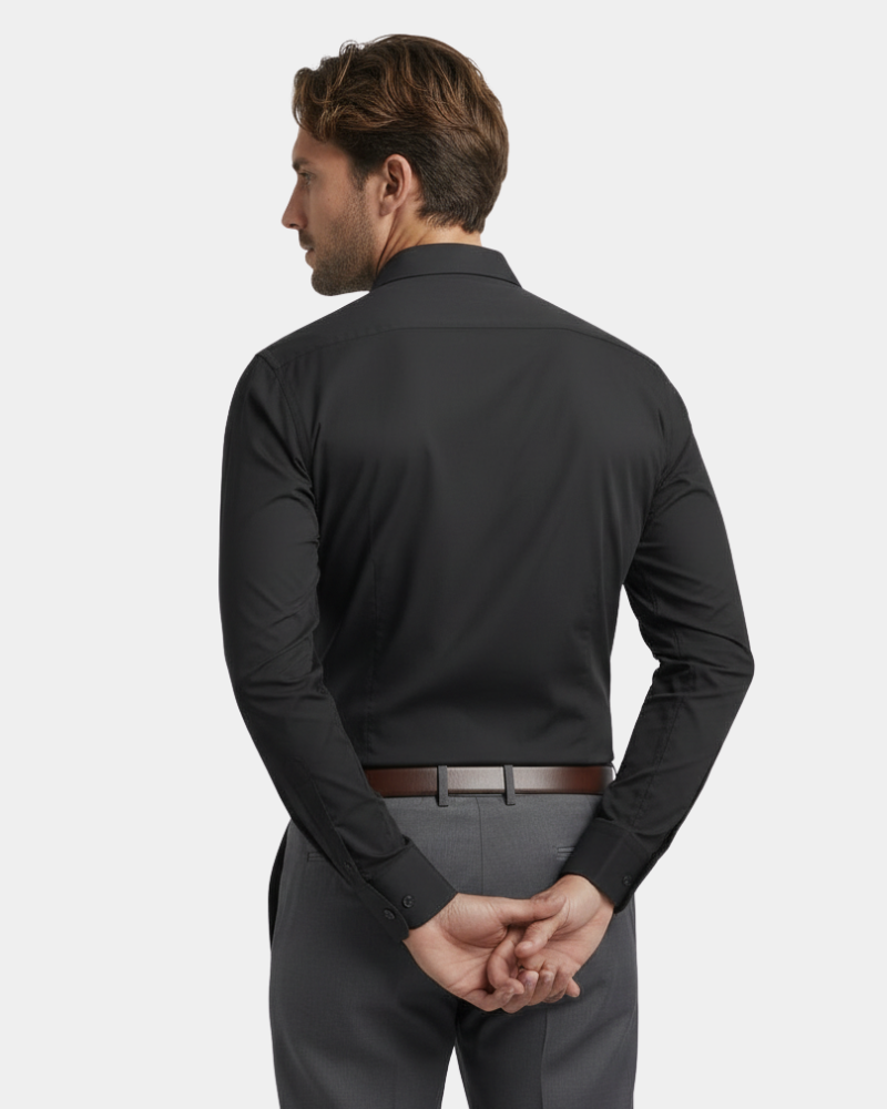 Tailored back view of a luxury charcoal performance shirt. Minimalist slim fit silhouette in breathable stretch fabric.