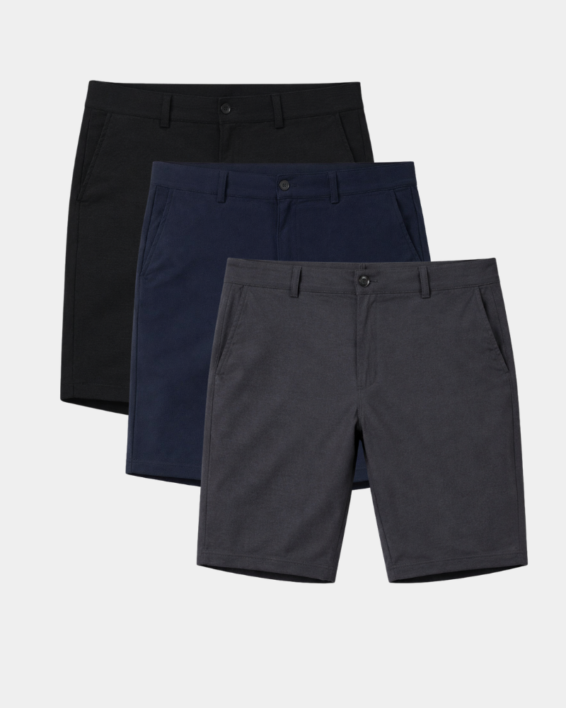 Luxury minimalist stretch cotton denim jeans in black, navy, and charcoal. Slim fit with refined heathered texture.