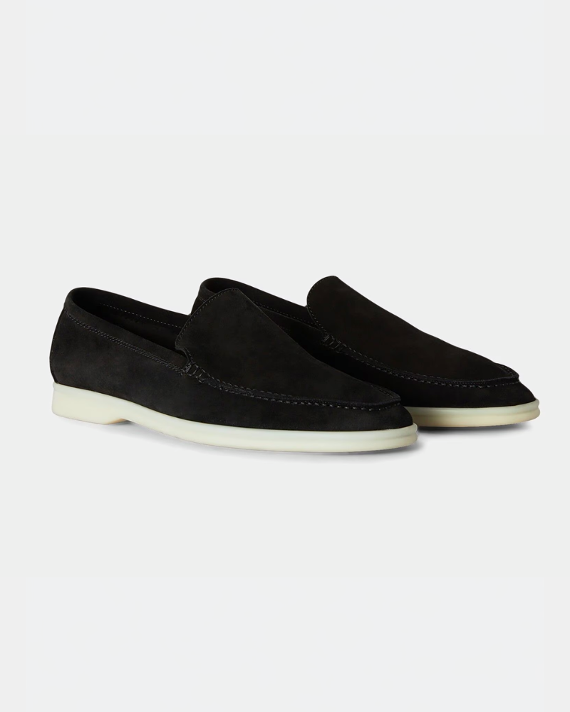 By Alden Luxury black suede yacht loafers with minimalist white soles, showcasing an elegant slip-on fit and premium texture. #color_black