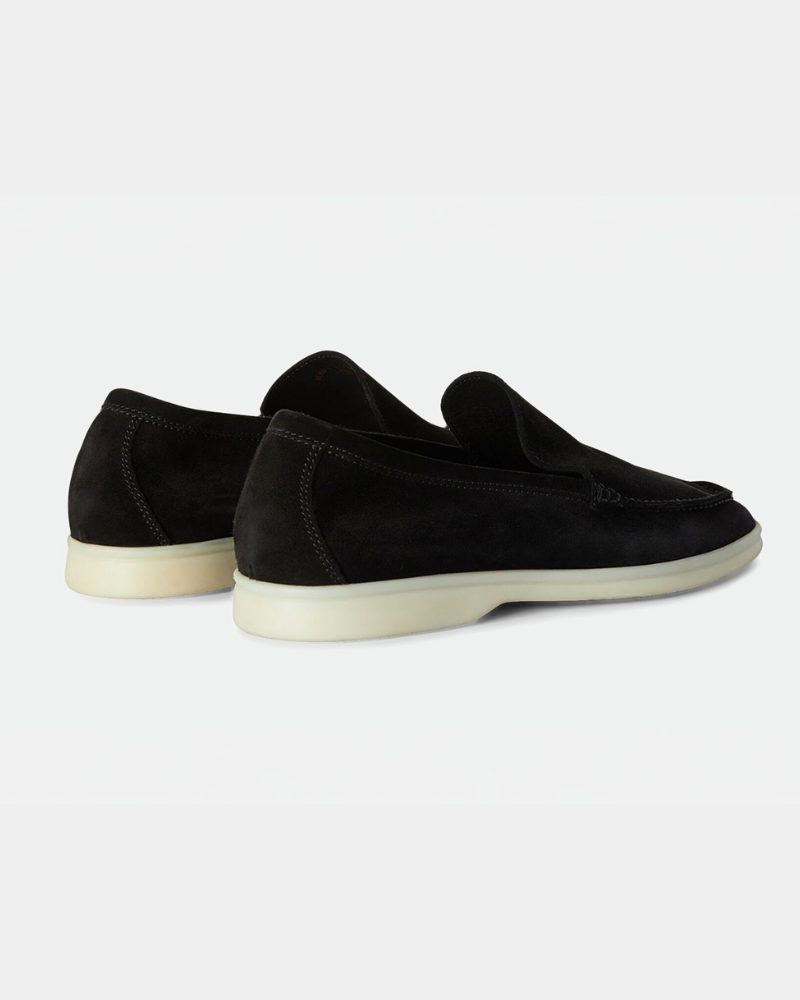 By Alden Minimalist luxury black suede loafers showing the heel and white rubber sole for a comfortable, premium fit. #color_black