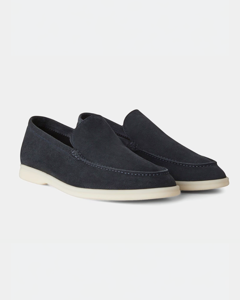 By Alden Luxury navy suede yacht loafers with minimalist cream soles, highlighting an elegant slip-on fit and premium texture. #color_navy