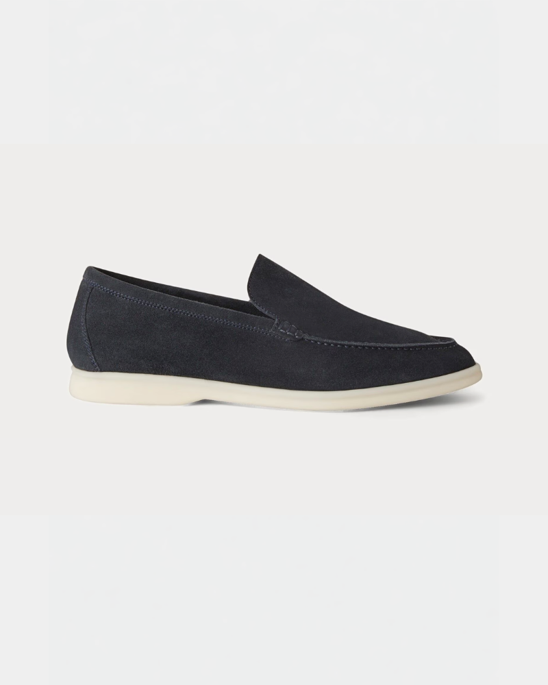 By Alden Minimalist luxury navy blue suede loafers with cream rubber soles, featuring a clean slip-on fit and premium texture. #color_navy