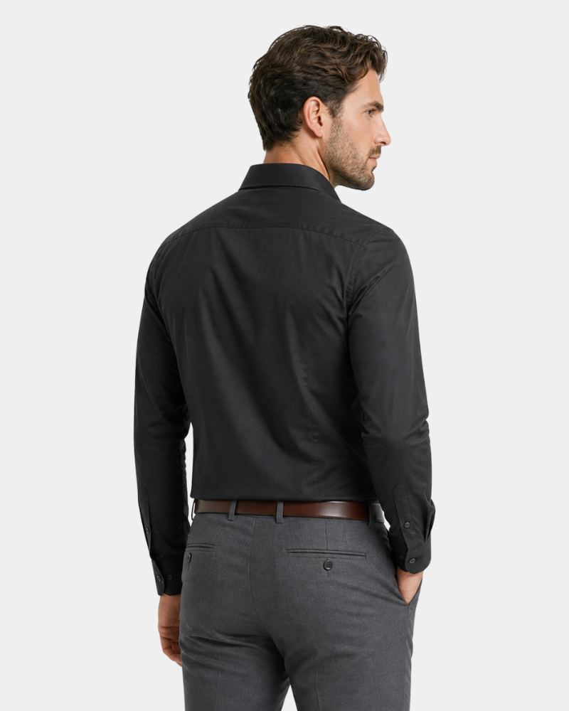 By Alden Black Slim Fit Dress Shirt worn by a White male model, cropped back angle view, light grey background #color_black