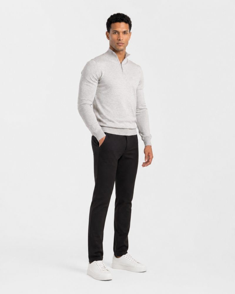 Man wearing a By Alden light gray sweater and black pants on a white background #color_gray