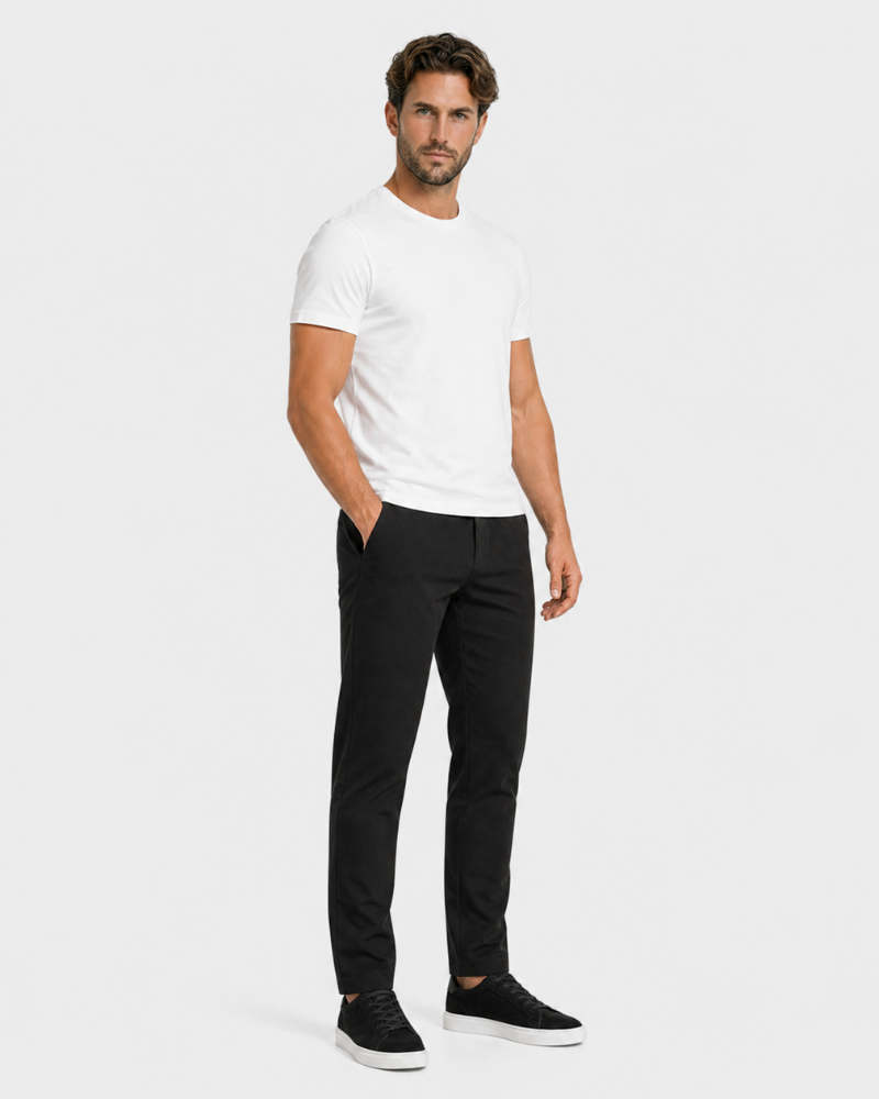 Man wearing a By Alden white t-shirt and black pants on a white background #Color_black