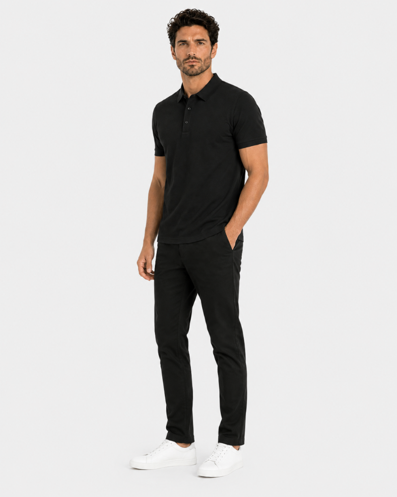 By Alden black knit polo shirt on male model, three-quarter view, full body, light gray background. #color_black