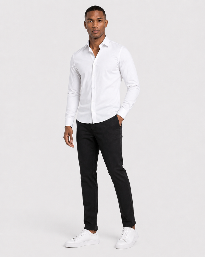By Alden white slim-fit dress shirt on male model, three-quarter view, full body, light gray background. #color_white