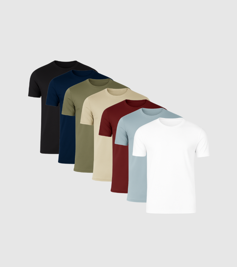 Set of six plain t-shirts in black, navy, green, beige, red, and white on a light gray background.