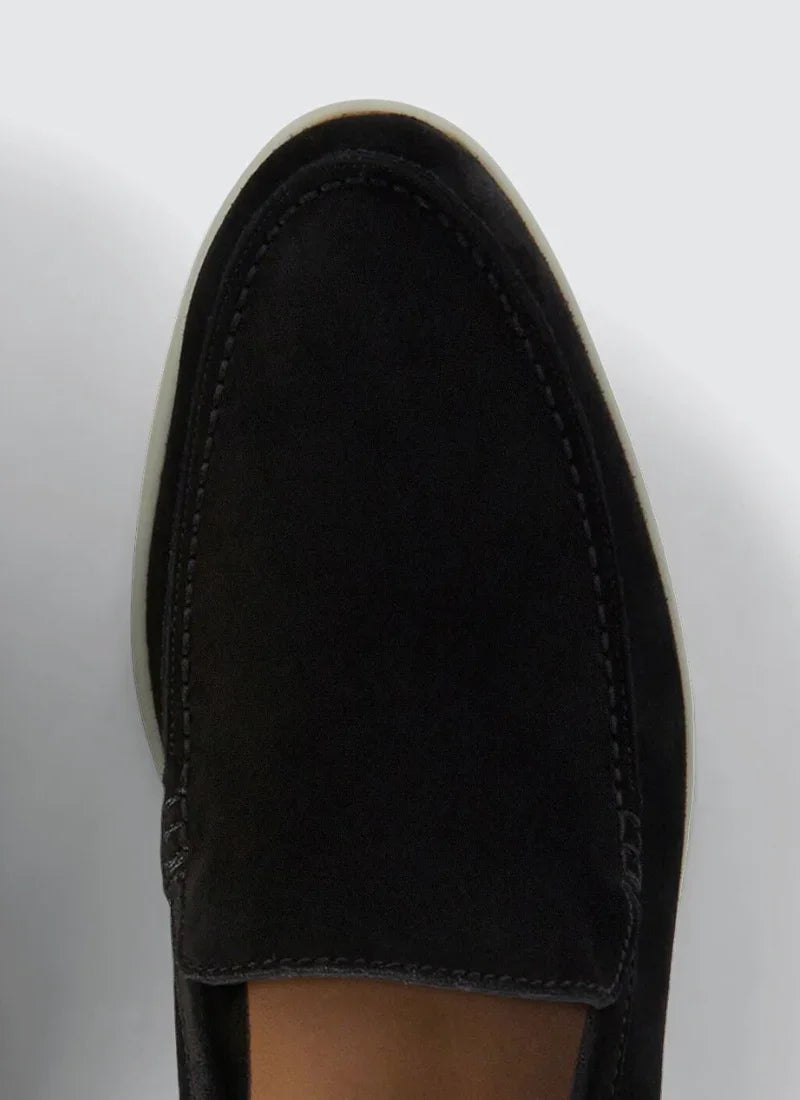 Close-up of black suede Alden Ash yacht loafer with white sole on white background