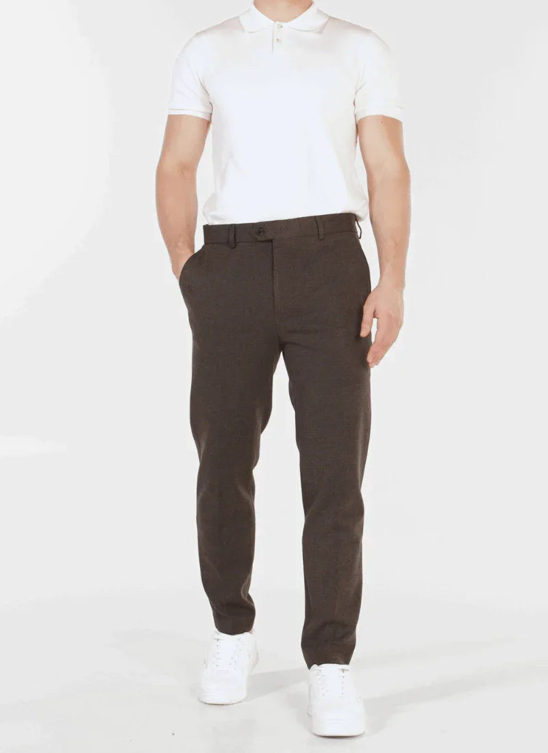 Man wearing Alden ash black classic wool mix trousers with white polo shirt and white sneakers