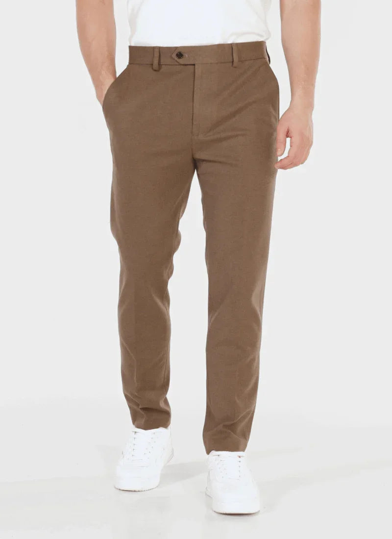 Men's classic brown wool blend trousers paired with white sneakers and a white shirt