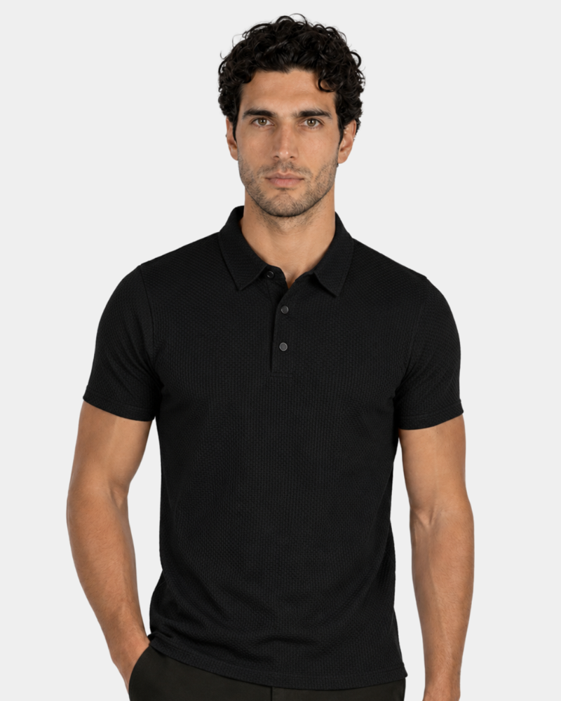 Man wearing a black polo shirt against a plain background #Color_black