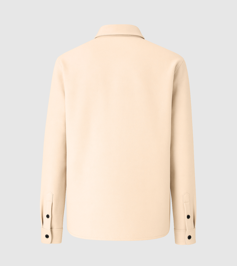 Back view of a beige long-sleeve shirt with black buttons on cuffs and a collar on gray background