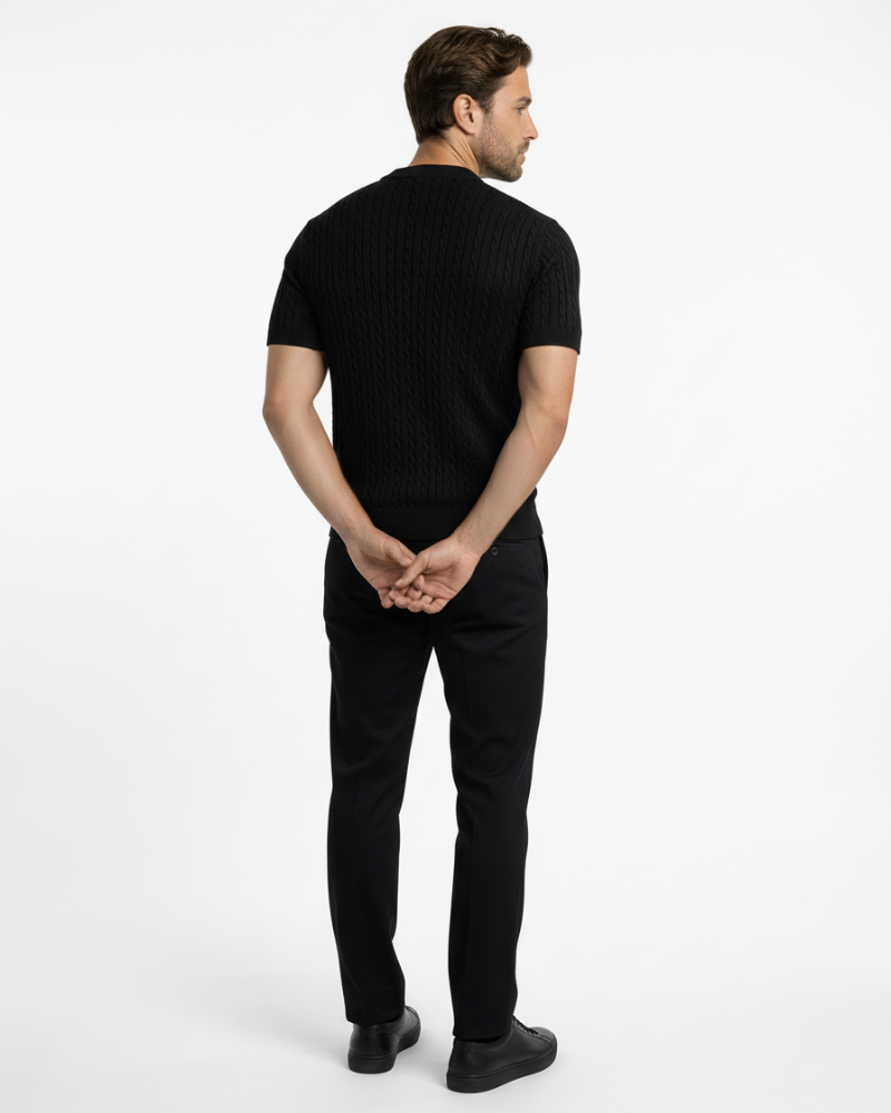 Back view of a black cotton cable knit t-shirt. Luxury minimalist short-sleeve sweater with premium texture.
