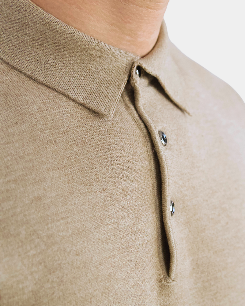 Close-up of By Alden luxury beige cashmere-wool knit. Minimalist heathered texture with refined collar and button details. #Color_camel
