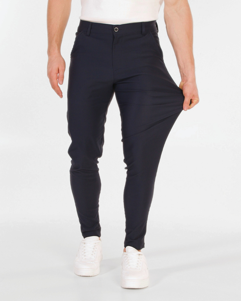 By Alden Minimalist luxury navy chinos in a flexible stretch cotton blend, demonstrating a slim fit and premium durability. #color_navy