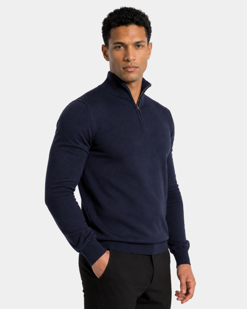 Man wearing a By Alden navy blue quarter-zip sweater on a light gray background #color_navy