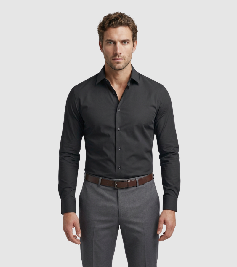 Man wearing a black dress shirt and gray pants on a light gray background