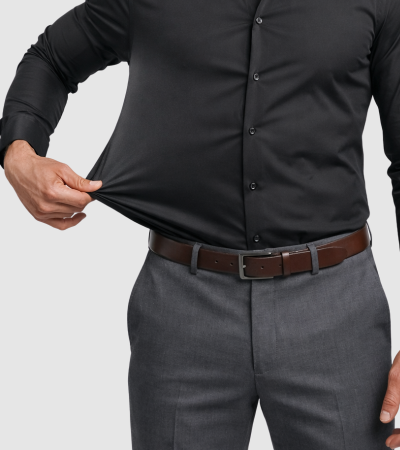Person wearing a black shirt and gray pants with a brown belt on a light gray background