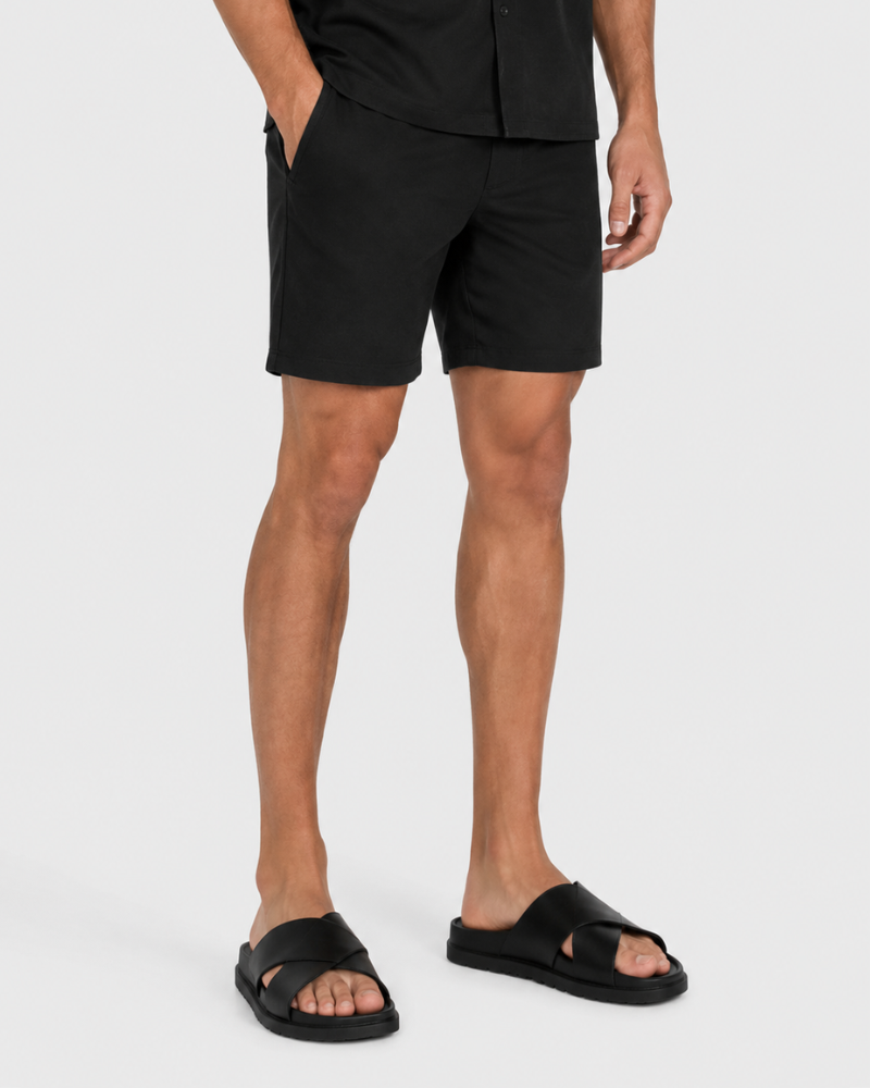 By Alden Black Linen Shorts worn by a male model, cropped front angle view, white background #Color_black