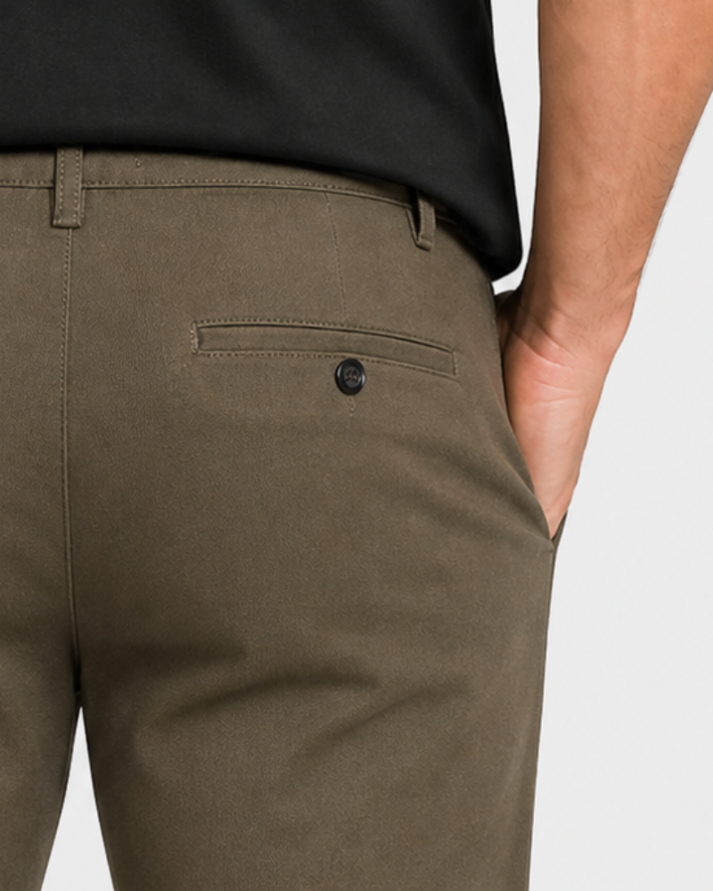 By Alden Close-up of olive green pants with a black button on a white background #Color_olive green