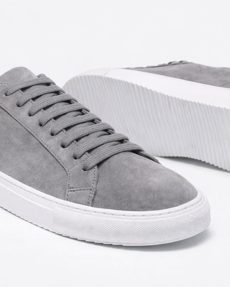 By Alden Grey Suede Classic Trainers, close-up angled view of toe and sole detail, white background #color_gray
