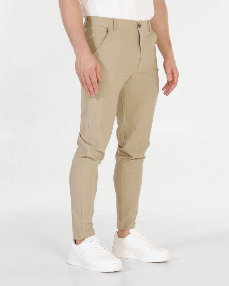 By Alden Minimalist luxury beige chinos in premium stretch cotton twill, featuring a sleek slim fit and tapered leg. #color_beige @model-info