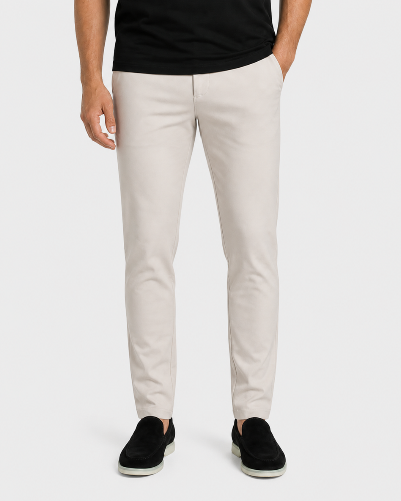 Person wearing By Alden beige pants and black shoes on a white background #Color_beige