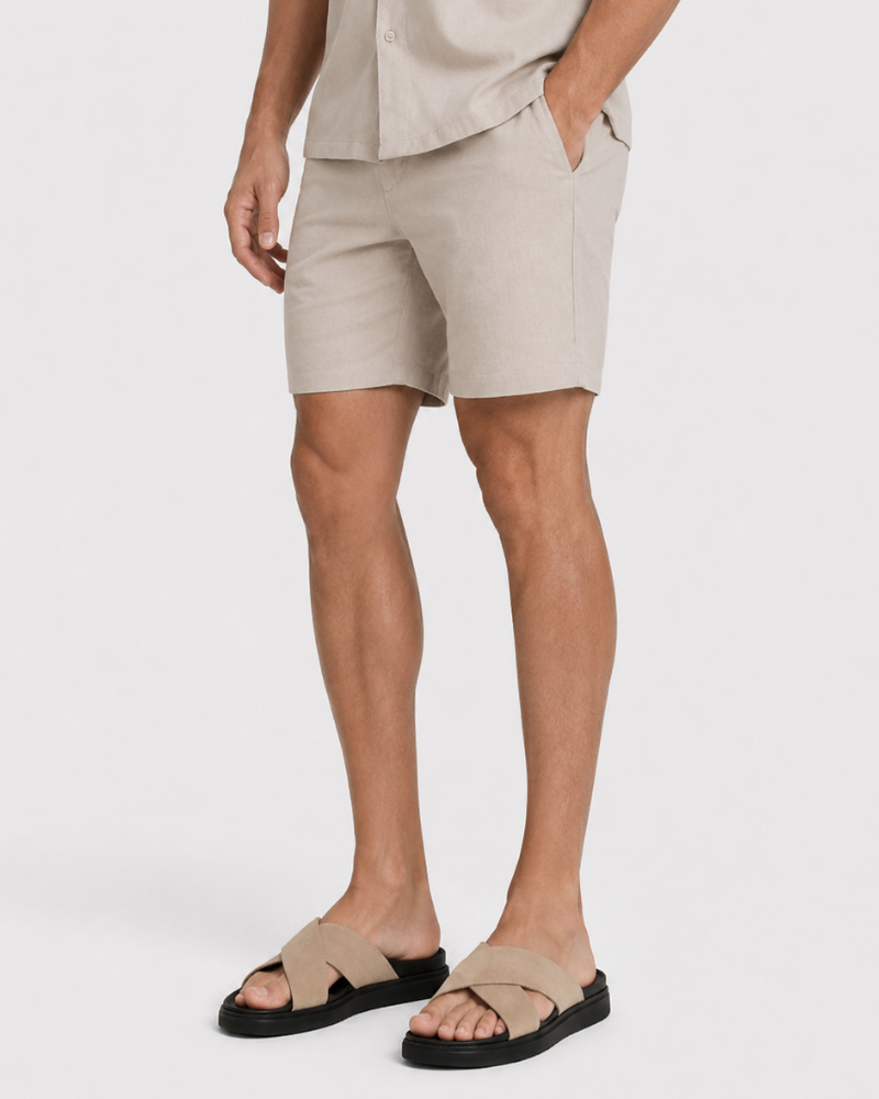 By Alden Sand Linen Shorts worn by a male model, cropped front angle view, white background #Color_deep stone