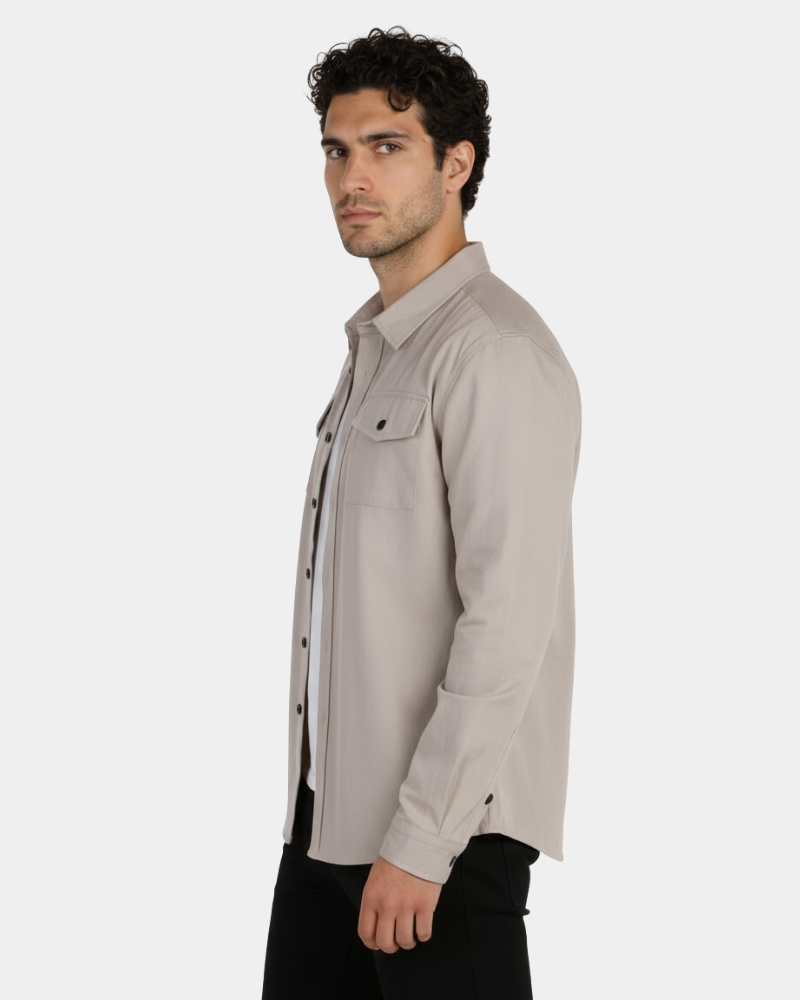 By Alden Sandstone Overshirt worn by a male model, cropped side profile view, light grey background #Color_deep stone