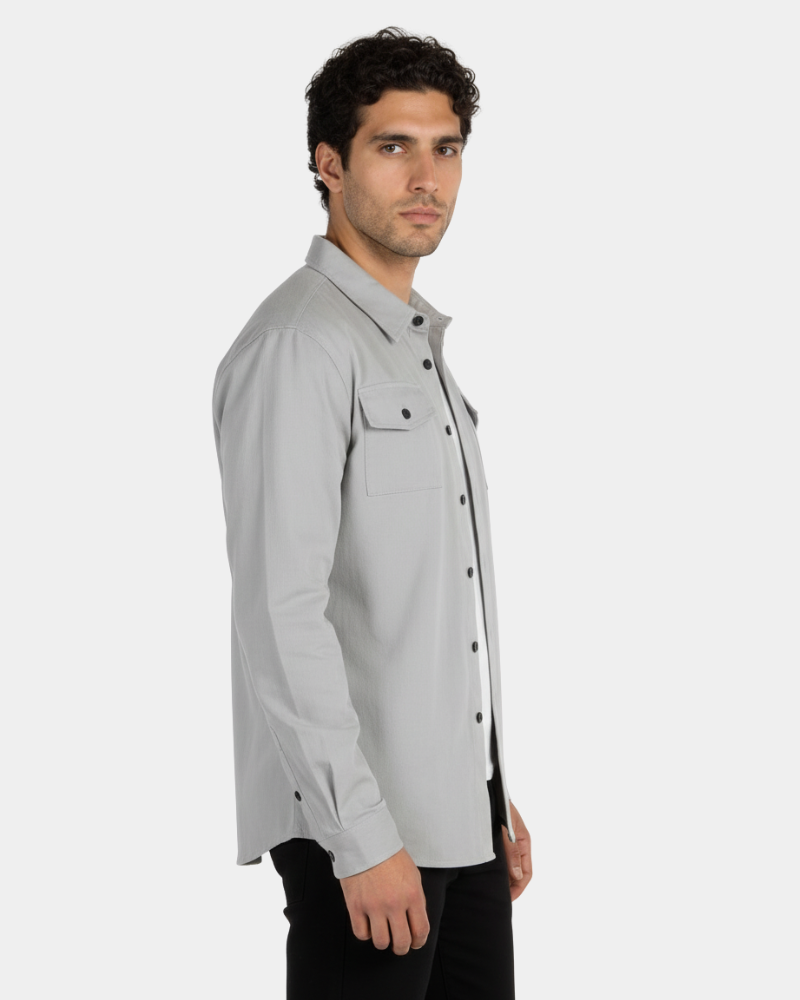 By Alden Stone Grey Overshirt worn by a male model, cropped side profile view, light grey background #Color_Gray