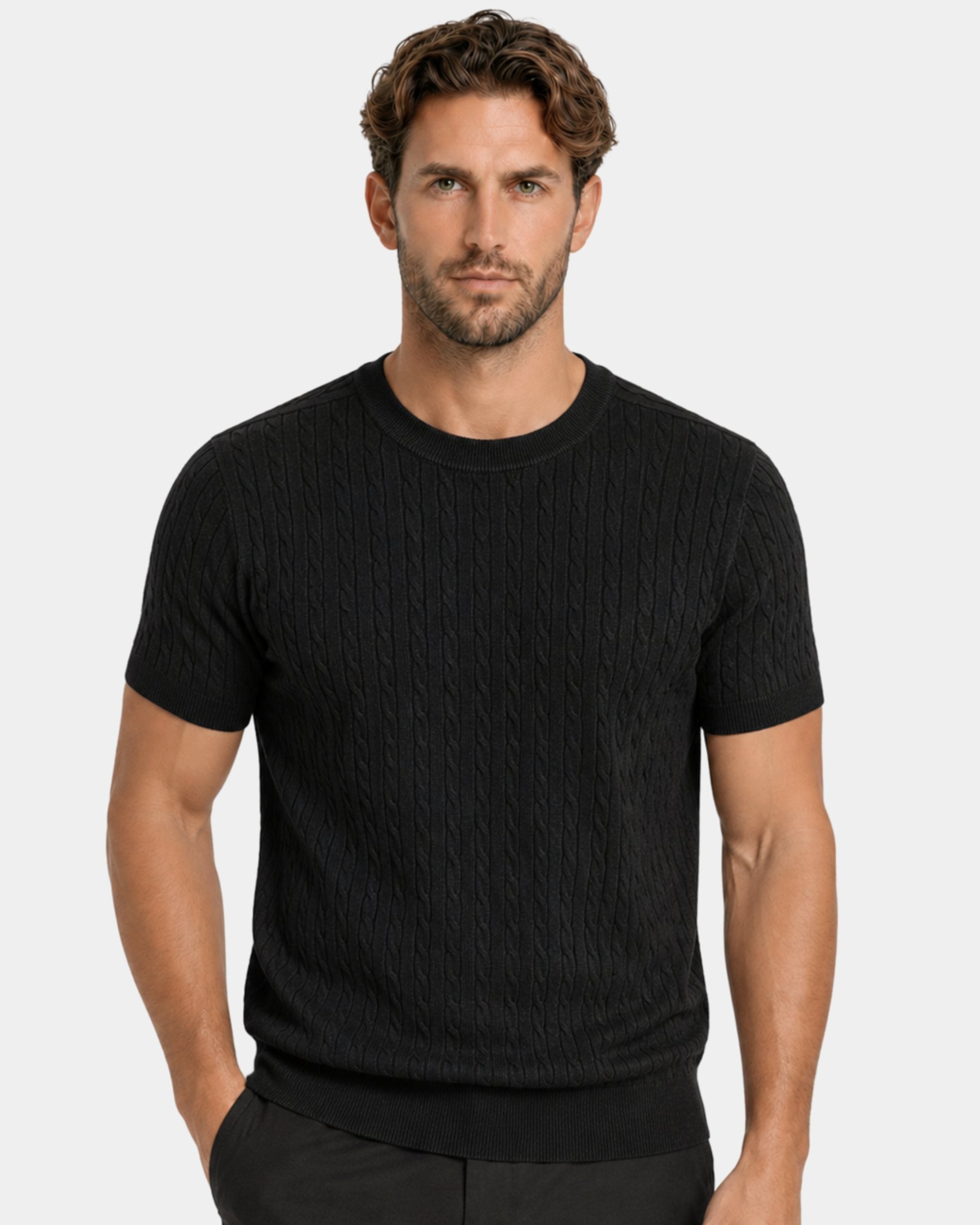 By Alden black cable-knit short-sleeve sweater on male model, front view upper body, light gray background #color_black