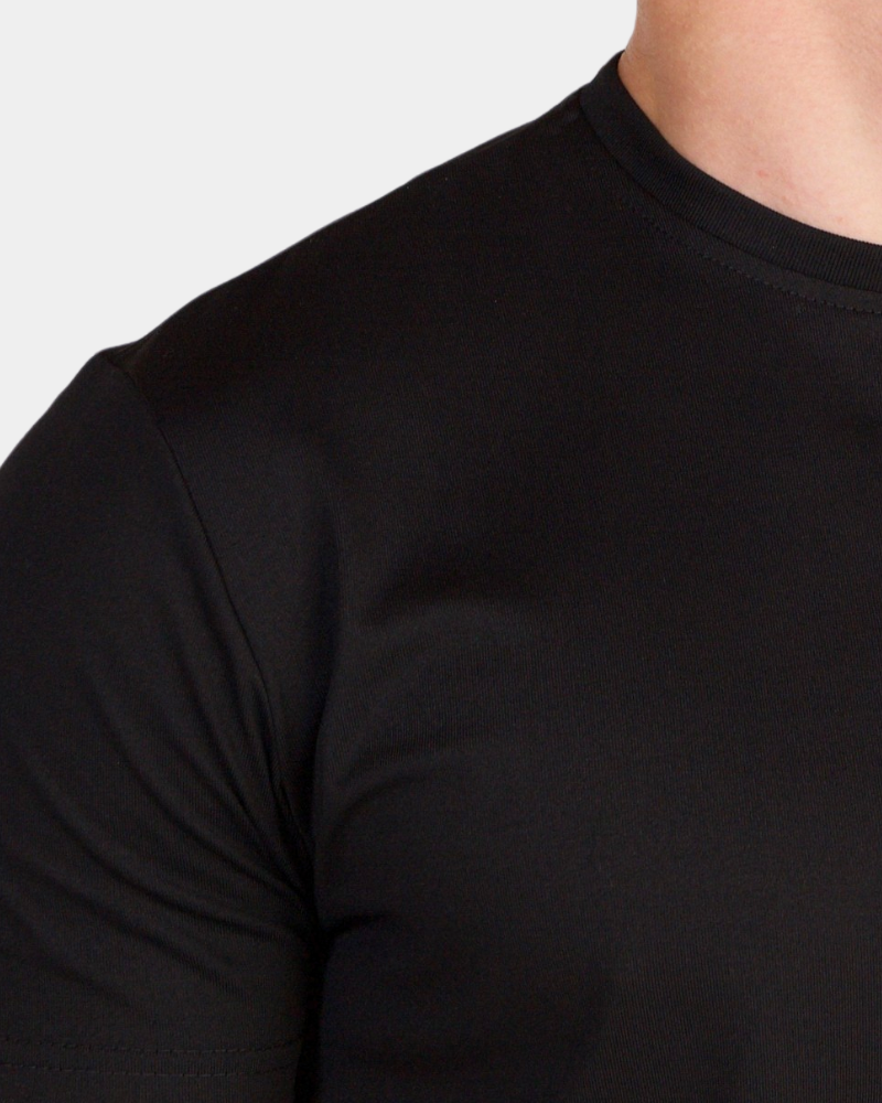By Alden black crew neck t-shirt on male Caucasian model, close-up shoulder detail, gray bg #Color_black