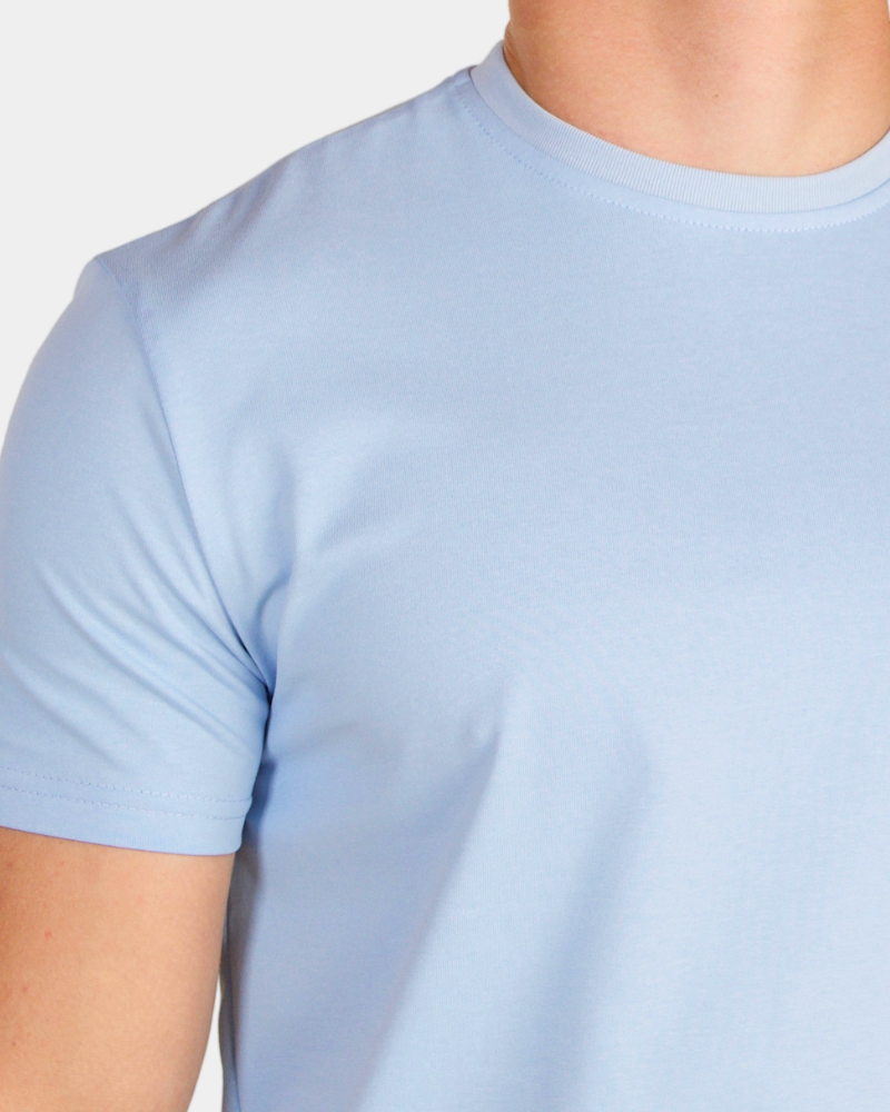 By Alden light blue crew neck t-shirt on male Caucasian model, close-up shoulder detail, gray bg #Color_light blue