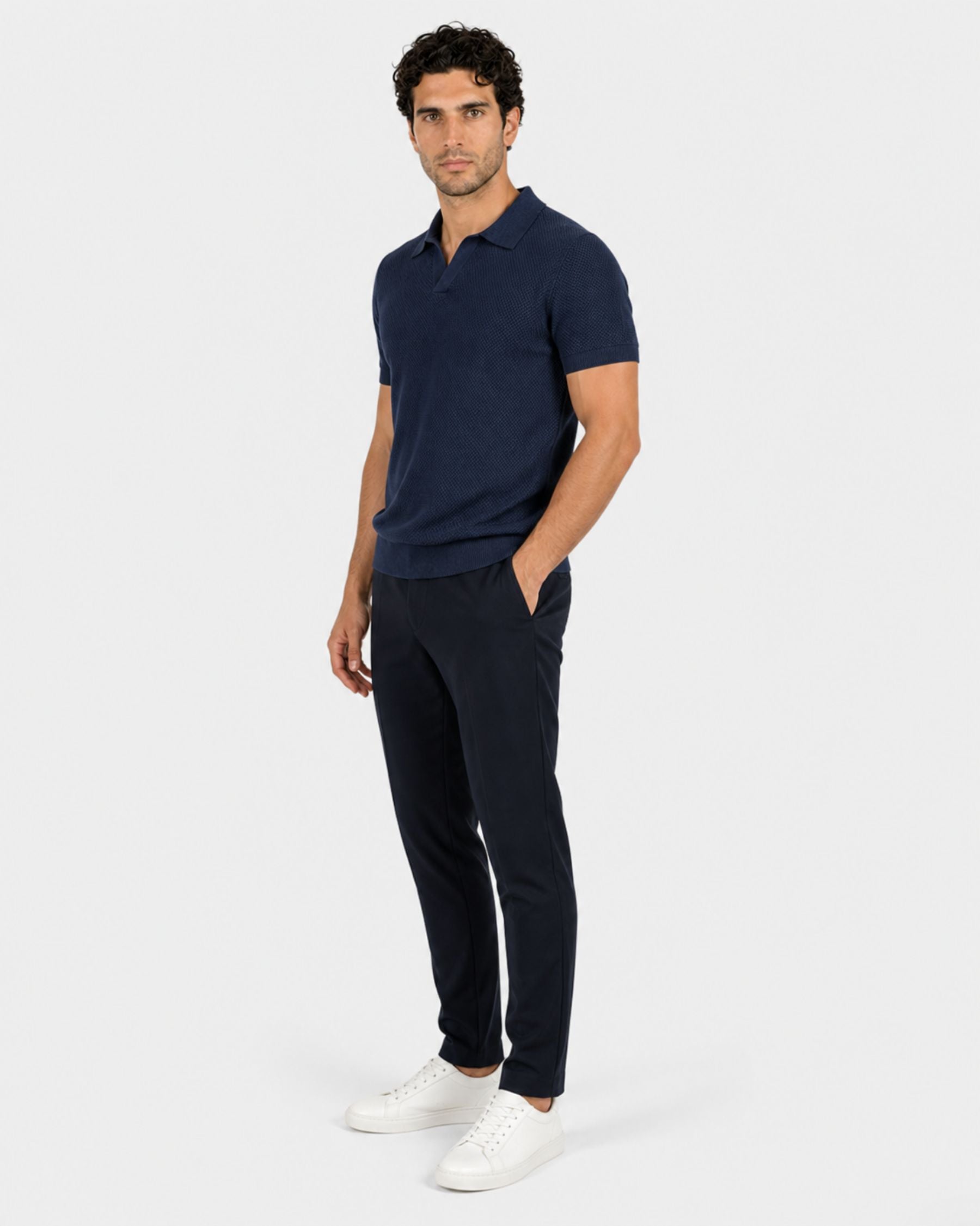 By Alden navy open-collar knit polo shirt on male model, three-quarter view, full body, light gray background. #Color_navy