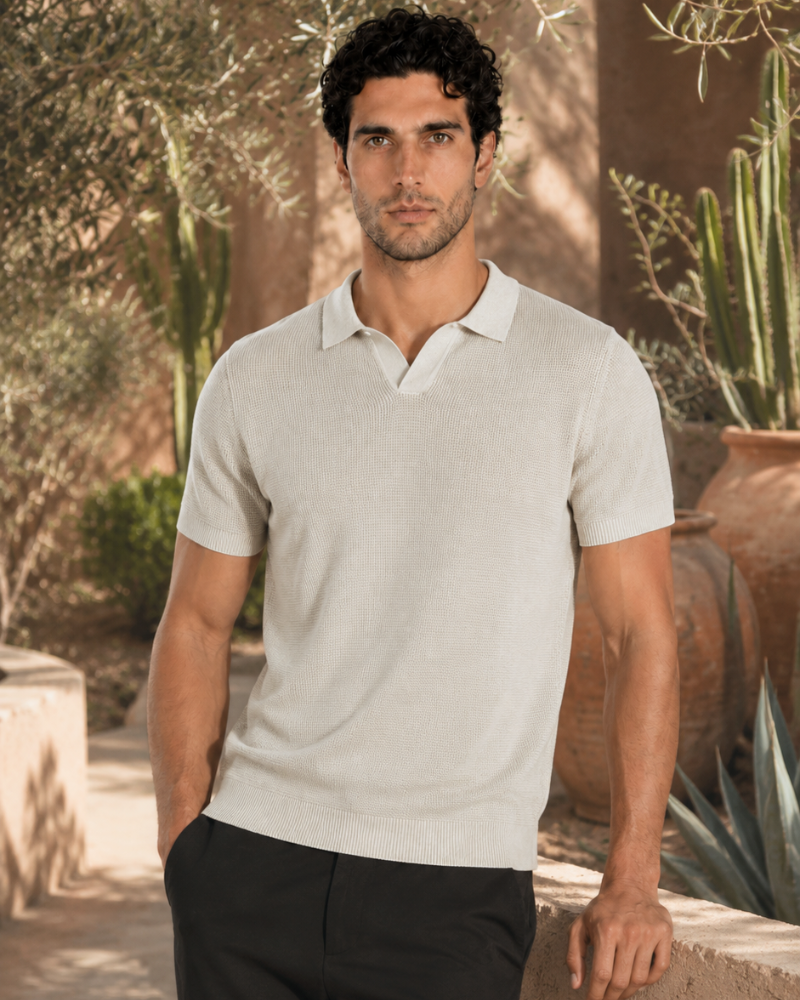By Alden off white open-collar knit polo shirt on male model, front view, upper body, outdoor warm beige background. #color_off white