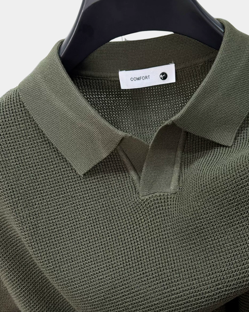 By Alden olive green open-collar knit polo shirt collar and label detail, hanger, close-up, light gray background. #color_olive green