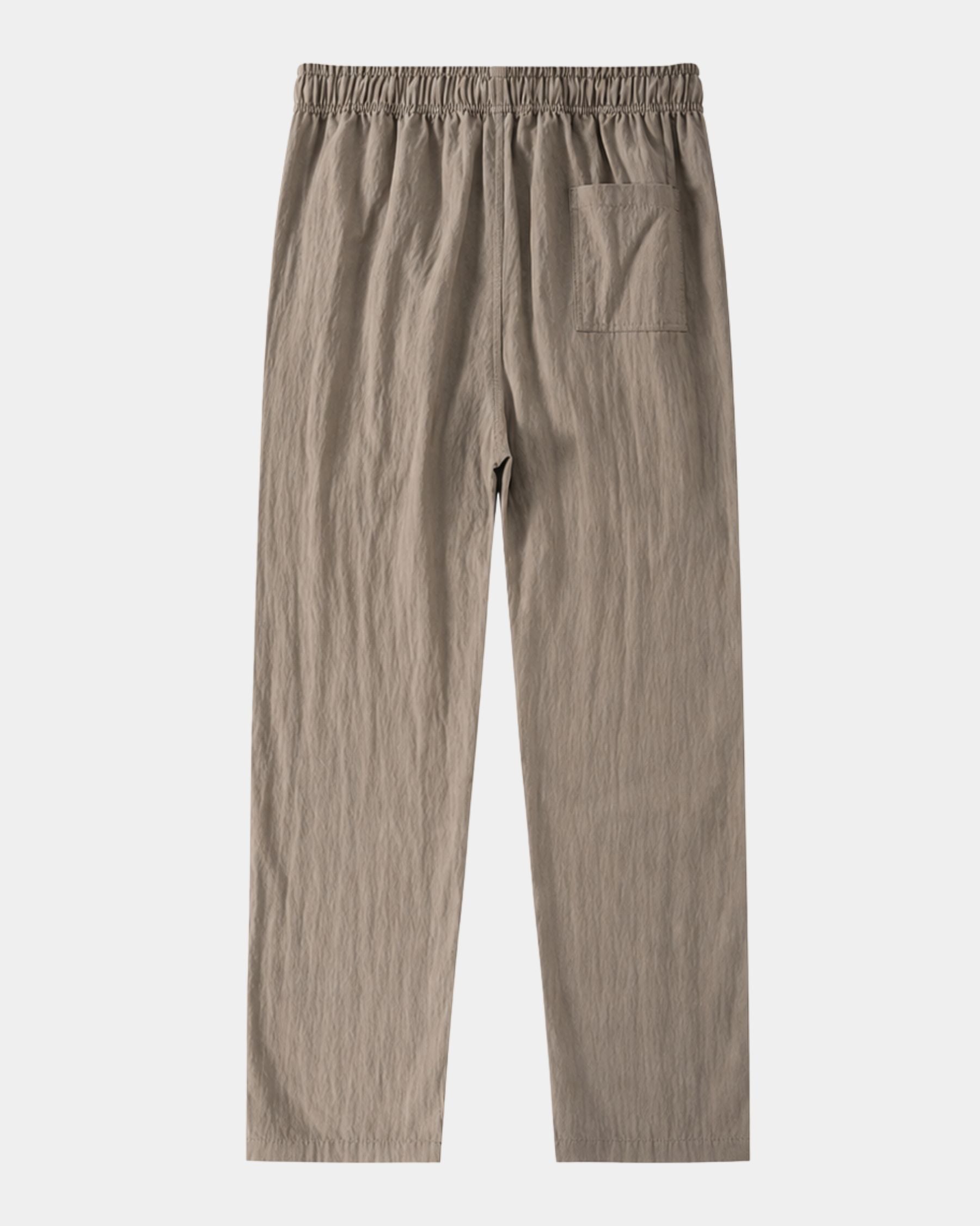 By Alden taupe linen drawstring trousers, flat lay back view with back pocket detail, light gray background #color_taupe