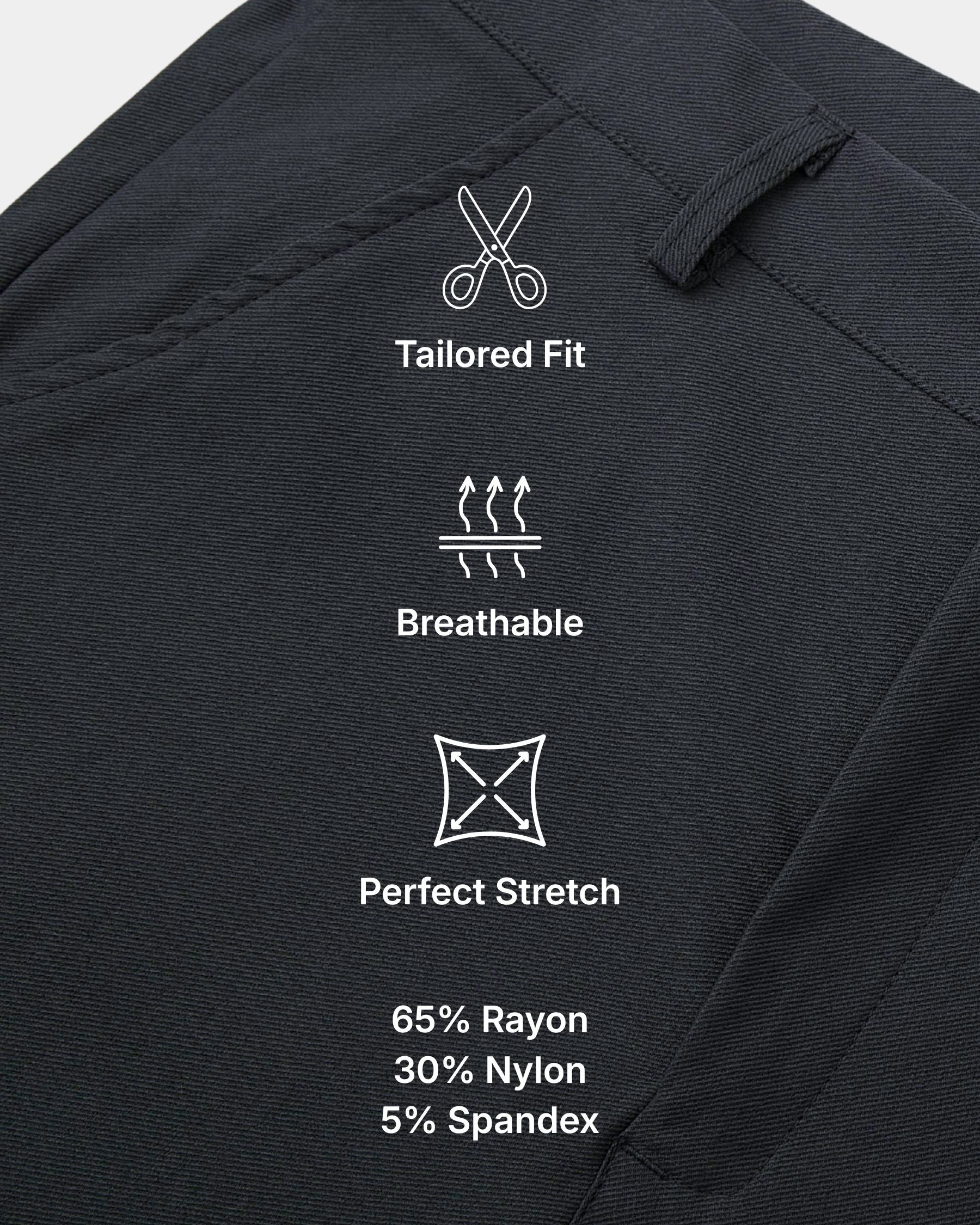 Close-up of dark charcoal fabric with white printed icons and text reading 'Tailored Fit,' 'Breathable,' and 'Perfect Stretch,' plus material percentages. This is an auxiliary informational product image rather than a standard product photo.
