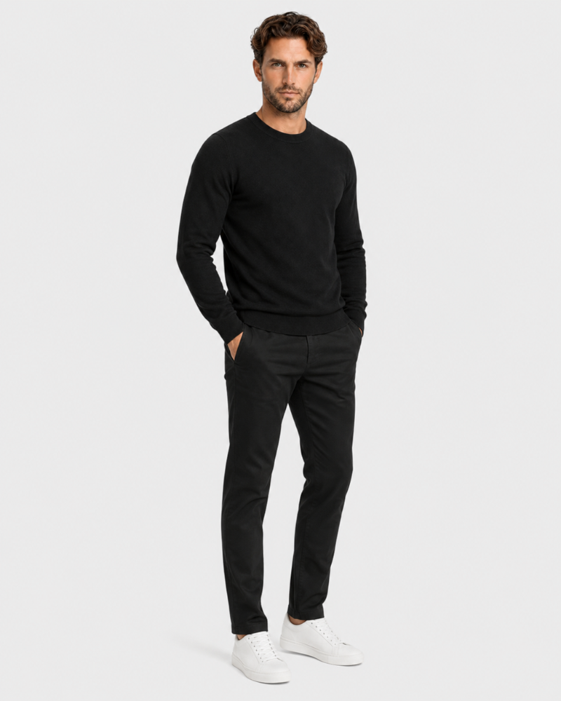 Man wearing a By Alden black long-sleeve shirt and black pants on a white background #Color_black