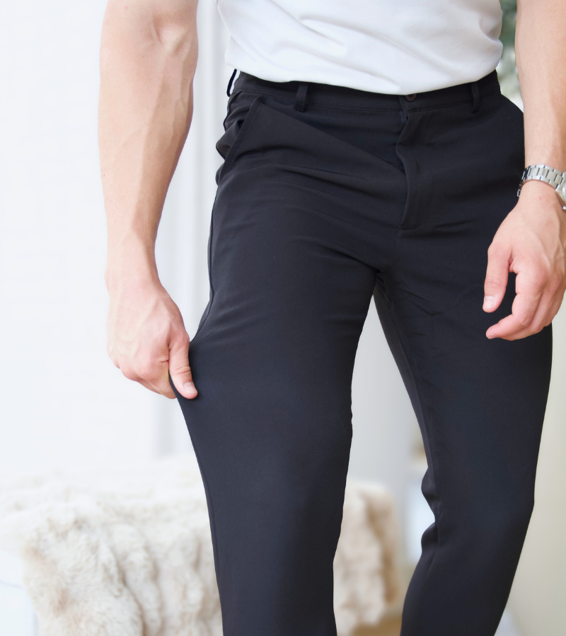 Person wearing dark pants with a blurred background