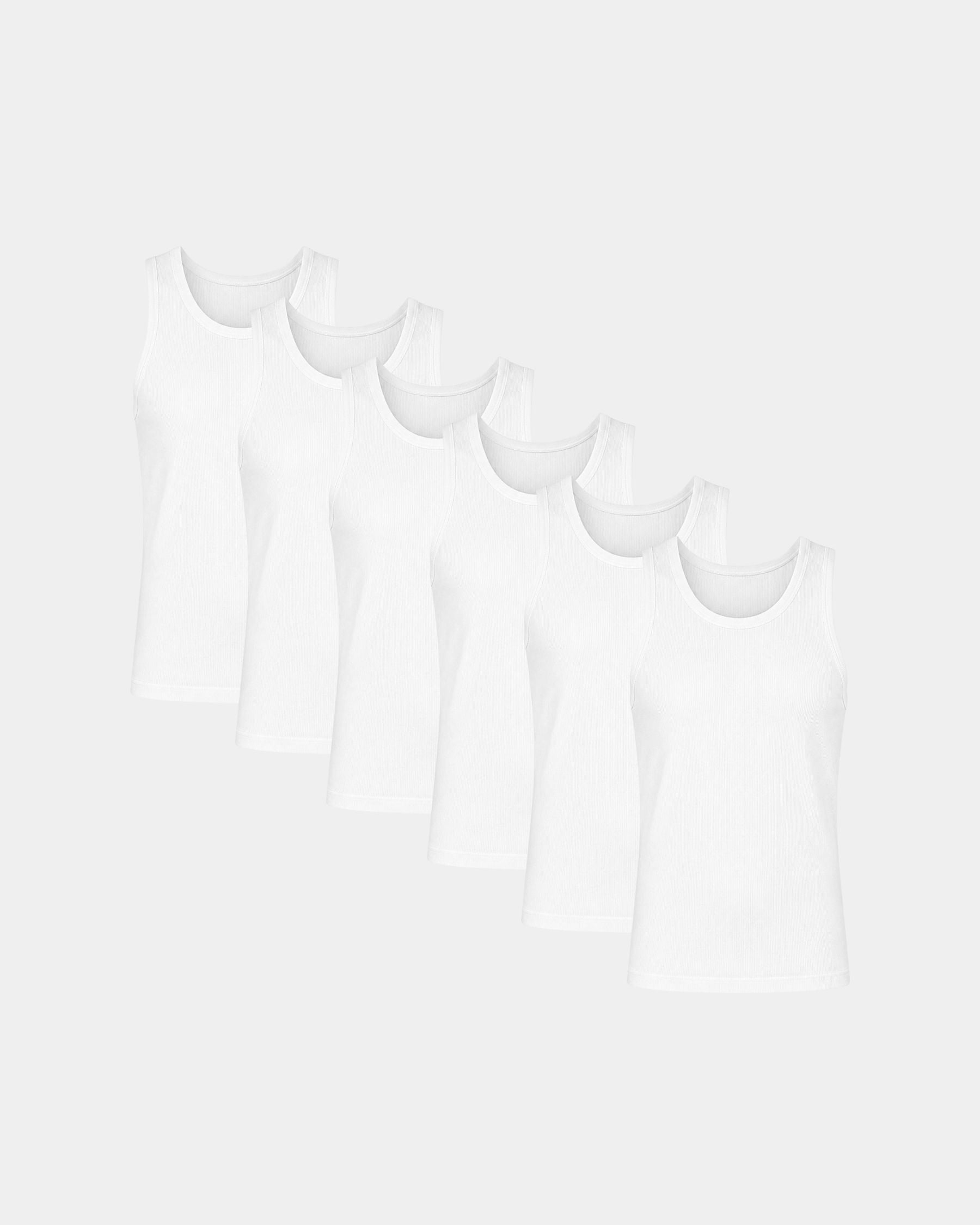 Six white sleeveless tank tops arranged in a staggered row on a light gray background.